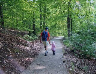Ed holding Michaela's hand in woods 2014.jpg