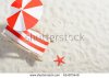 stock-photo-red-and-white-deckchair-on-the-beach-top-view-614973449.jpg