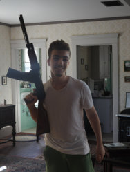 lazy jpeg of a guy in a house armed with a dangerous weapon.jpg